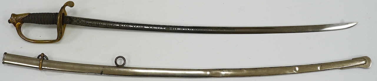 A 1954 US Marine Wilkinson Sword belonging to Staff Sergeant James Devereux 2nd believed to be son of General Devereux, etched blade, regulation brass hilt, in its plated scabbard, blade 76.5cm. Condition - good